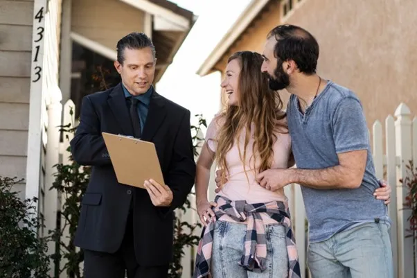 Inspector showing pre-listing inspection report to homebuyer